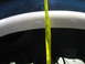1995 Ford C-350 (Centurion Conversions) - Close-up of a white wheel well arch with a tape measure indicating clearance.