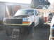 1987 Ford Bronco - This Ford Bronco appears to be undergoing repairs or modifications, with its hood up and front bumper removed.