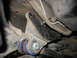 1995 Ford C-350 (Centurion Conversions) - Underside view of a vehicle's suspension system, focusing on a specific part.