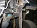 1995 Ford C-350 (Centurion Conversions) - Close-up view of a custom suspension component, likely a modification, mounted to the vehicle's frame.