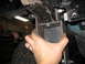 1995 Ford C-350 (Centurion Conversions) - Custom suspension bracket being installed on a vehicle frame.