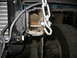 1995 Ford C-350 (Centurion Conversions) - The tow hitch receiver on the vehicle's frame is shown with a chain connected to it.