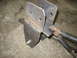 1995 Ford C-350 (Centurion Conversions) - Close-up view of a custom-welded metal bracket, possibly for a vehicle suspension modification.