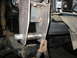 1995 Ford C-350 (Centurion Conversions) - Custom suspension part installation, showing a bolted bracket and a clamp.