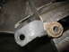 1995 Ford C-350 (Centurion Conversions) - A worn suspension component is secured in a vise, ready for modification or repair.