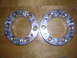 1983 Ferrari Enzo - Two brake rotors are shown on a wooden surface. No vehicle is visible.