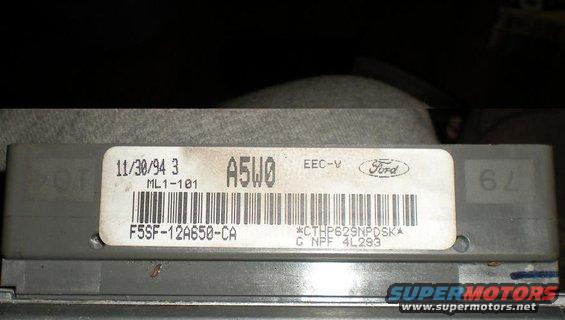 Gray Ford EEC-V computer module with a white label showing date 11/30/94, part number F5SF-12A650-CA, and barcode