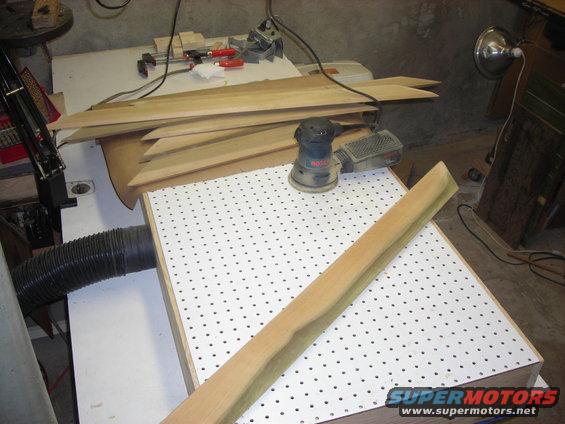 Woodworking tools and lumber on a workbench