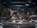 1995 Ford Bronco - The engine bay of a vehicle, an aftermarket air intake system and various engine components.