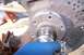 1990 Ford Bronco - Wheel hub and brake rotor assembly being cleaned, likely during maintenance or repair.