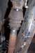 1990 Ford Bronco - Close-up view of a vehicle's driveshaft boot and U-joint, showing signs of rust and wear.