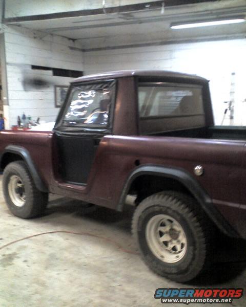 Maroon 1968 Ford Bronco 3/4 front view in garage