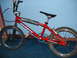 1977 Ford F-250 - BMX bike with red frame, chrome forks, and blue chainring.