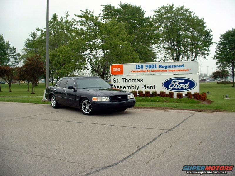 Black Ford Crown Victoria parked in front of the St. Thomas Assembly Plant sign