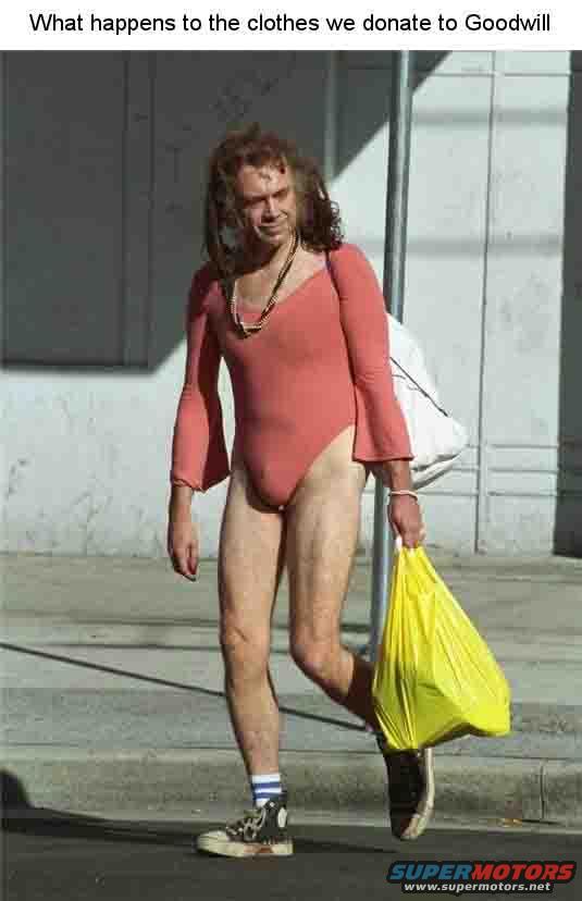 Person in a pink leotard with bell sleeves walks down a street carrying a white bag and a yellow plastic bag
