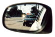 Side mirror reflection of police car