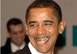 1990 Ford Bronco - Barack Obama is pictured with gold grills, with a blurred figure behind him.