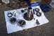1990 Ford Bronco - Automotive parts, possibly for a 1990 Ford Bronco, are laid out for inspection or repair.