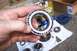 1990 Ford Bronco - A Timken wheel bearing is shown, with other automotive parts scattered on a white cloth.