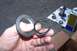 1990 Ford Bronco - Close-up of a ball joint seal and bearing, with related automotive parts laid out on a cloth.