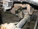 1995 Ford C-350 (Centurion Conversions) - Modified rear axle assembly with visible suspension components and hardware.