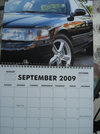 Calendar page showing September 2009 with a black sedan in the upper portion