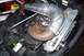 2004 Arctic Cat F-7 Firecat - Engine compartment of a 2004 Arctic Cat F-7 Firecat snowmobile, showing the exhaust pipe and electrical components.