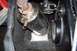 2004 Arctic Cat F-7 Firecat - Detail shot of the exhaust system and drive components on a snowmobile.