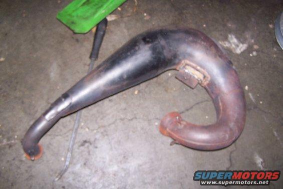 Exhaust pipe with a green plastic piece in the background