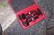 1990 Ford Bronco - A red case holds a ball joint press tool kit with multiple components for automotive repair.