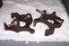 1990 Ford Bronco - Two ball joint assemblies, likely for a truck or SUV, are laid out on a white quilted surface.
