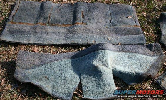 Worn blue carpet pieces on the ground