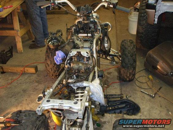 pics-031.jpg Here I had the Raptor tore apart putting new gaskets and o-rings on the stator side of the engine. My chain had come off and busted the old case in the oil tube and was leaking bad.