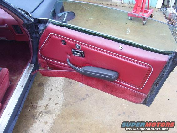 Red interior door panel and seat of a 1978 Pontiac Trans Am