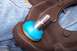 1990 Ford Bronco - A close-up view of a vehicle's ball joint assembly, a bright blue protective boot.