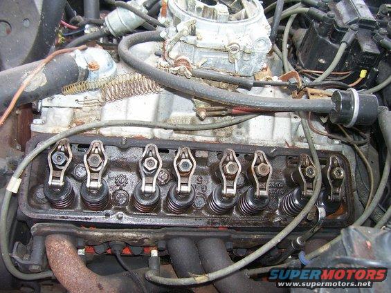 Close-up of an engine's valve train, showing rocker arms and springs
