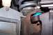 1990 Ford Bronco - Close-up view of a vehicle's ball joint assembly, showing a blue boot and red grease.