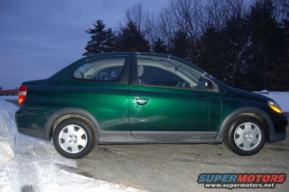Green 2001 Toyota Echo sedan, side view
