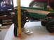 1996 Ford Bronco - A green and white RC truck body is shown next to a measuring tape, with large off-road tires visible.