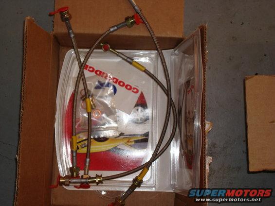 Box containing Goodridge braided brake lines with red fittings and yellow crimps