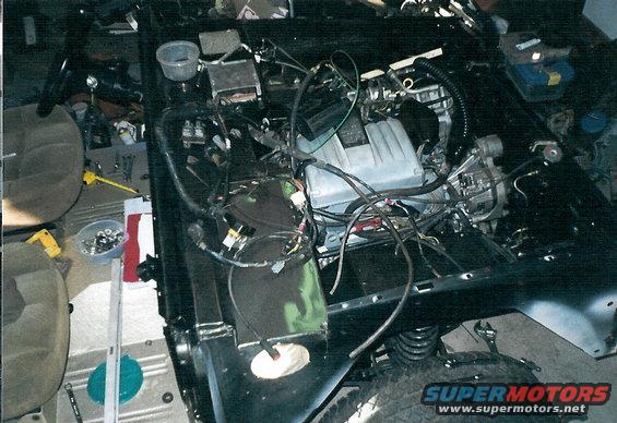 m2.jpg Even the Crown Vic plenum comes close to the hood, and I had to flip the IAC and move a throttle body heater line to fit the IAC around the master cylinder.  But it all works perfectly, and uses mostly stock parts that he'll be able to find at any parts store, dealership, or JY.