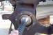1990 Ford Bronco - Wheel bearing assembly with a ribbed hose inserted, likely during maintenance or repair.