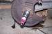 1990 Ford Bronco - Wheel hub assembly with red grease on the spindle, likely before installation or maintenance.