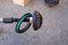 1990 Ford Bronco - A disassembled ball joint component shows wear on the roller bearing and a torn seal.