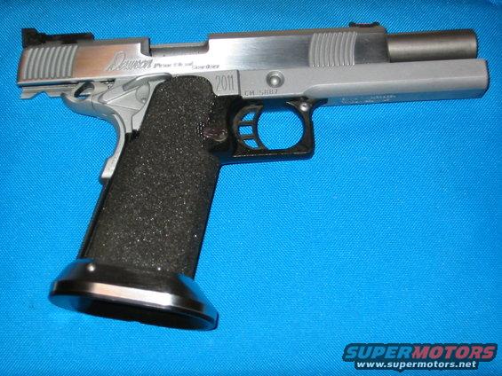 Silver pistol with black grip and 2011 marking