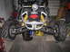 2006 Ford F1 - This go-kart features a distinctive red wolf logo on its front, along with prominent yellow suspension springs.