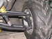 2006 Ford F1 - Close-up view of a go-kart's front suspension and tire assembly.