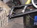 2006 Ford F1 - Close-up of a go-kart's front suspension system, showing the arm and shock.