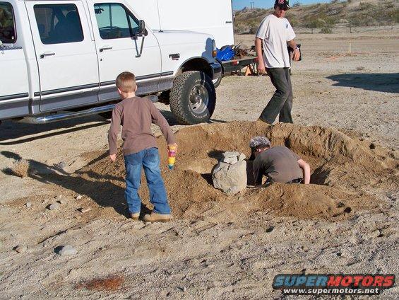 White pickup truck side view with children playing in dirt