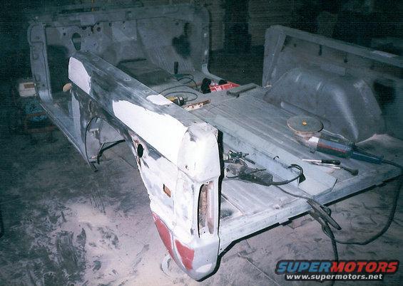 i1.jpg Meanwhile, in a remote location on the other side of the river...  The tub has been soda-blasted, and the rusty inner fenders, A-pillars, & rockers are being replaced.  That's a rocker in the bed.